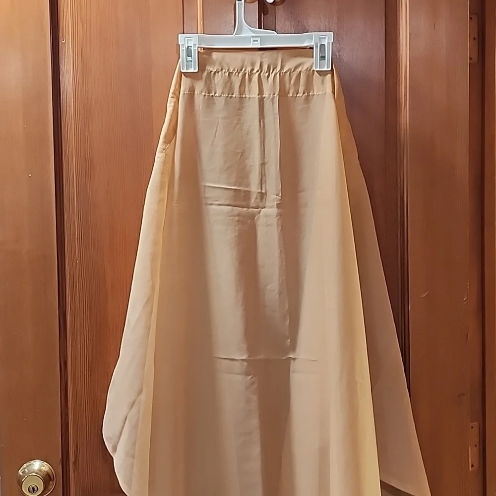 6 Sheer tan curtain panels